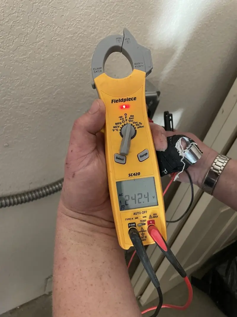 Voltage testing with clamp meter during Generator Installation in Cadillac